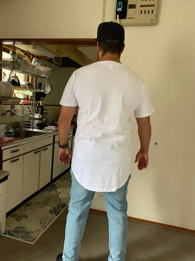 Back view of a man wearing MRMT High Street Mens T Shirt in a kitchen setting.