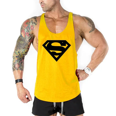 Men's bodybuilding fitness apparel featuring a yellow tank top with a black Superman logo.