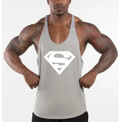 Model wearing men's bodybuilding fitness apparel tank top with Superman logo.