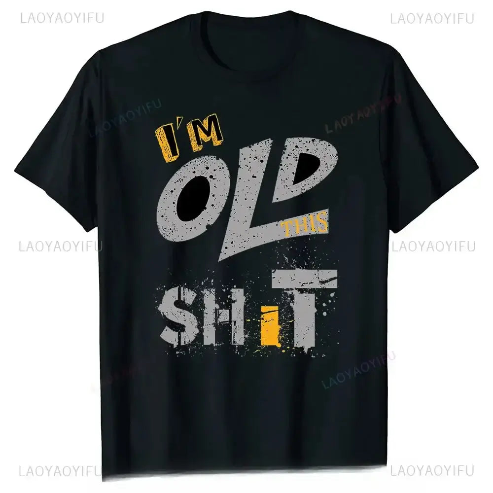 Men's graphic t-shirt with playful text saying 'I'm Old This Shit' in bold colors on a black background.