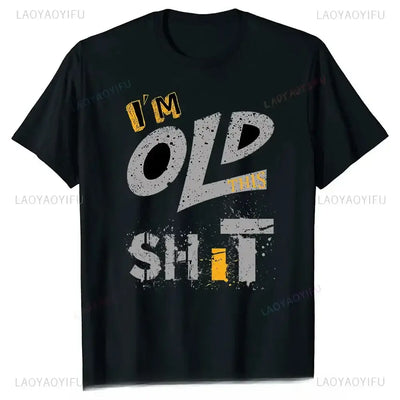 Men's graphic t-shirt with playful text saying 'I'm Old This Shit' in bold colors on a black background.