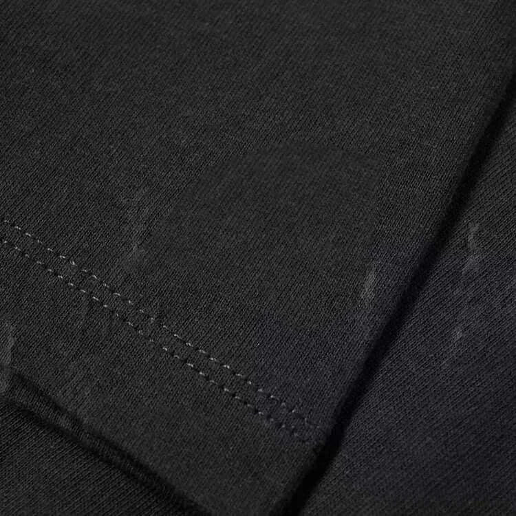 Close-up view of the fabric and stitching detail of the Stand T-Shirt for Men Graphic T Shirts Tops.